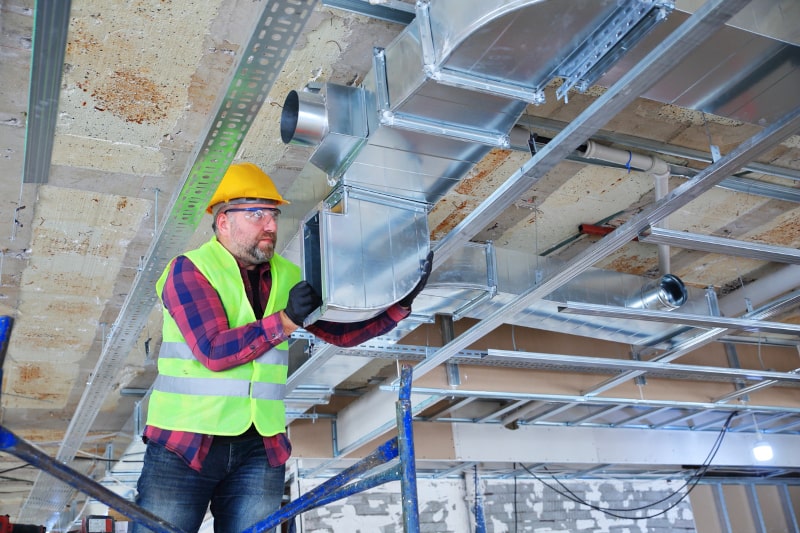 Man Working On A Commercial HVAC System